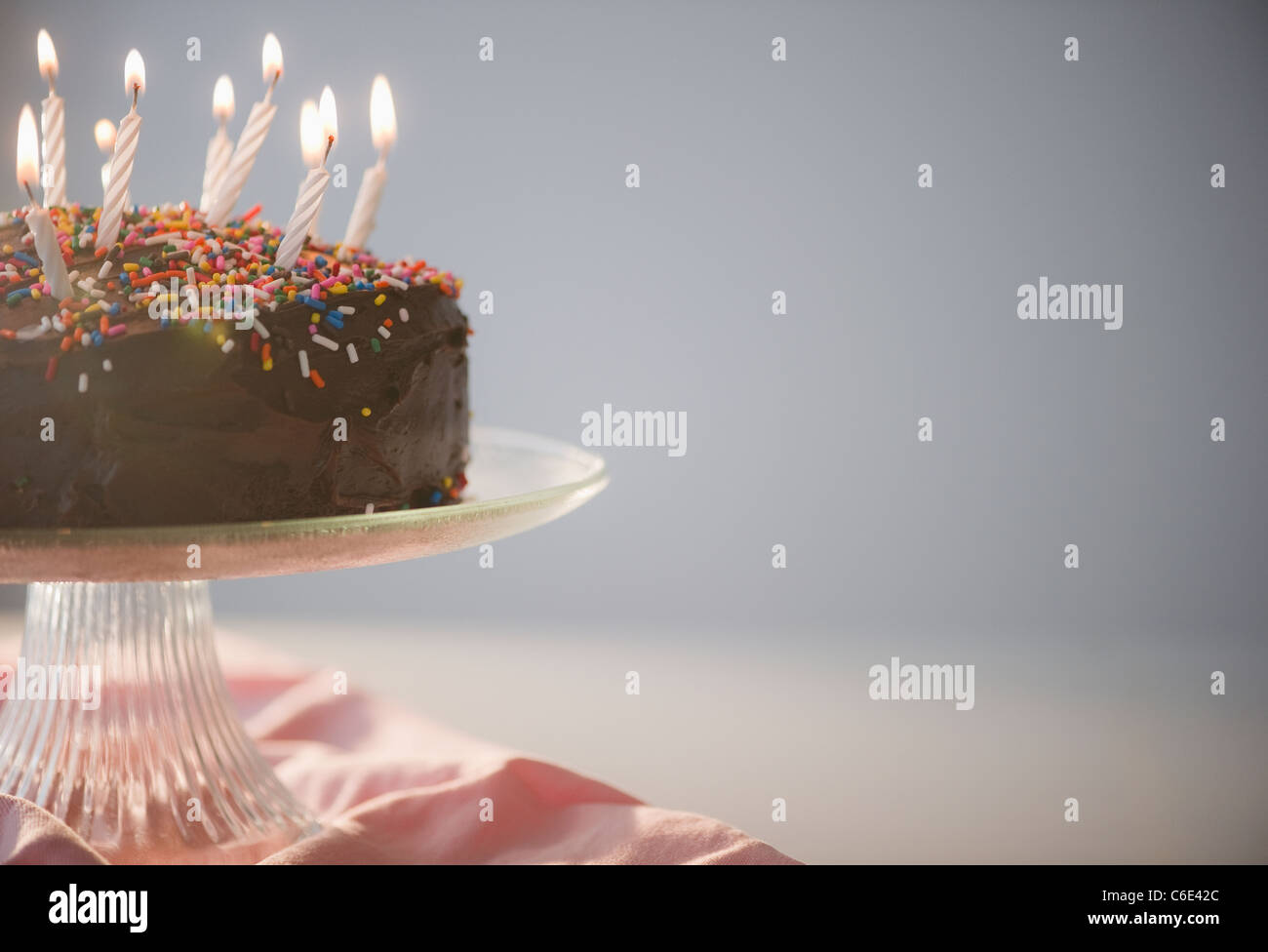 Close up of chocolate birthday cake with candles Stock Photo - Alamy