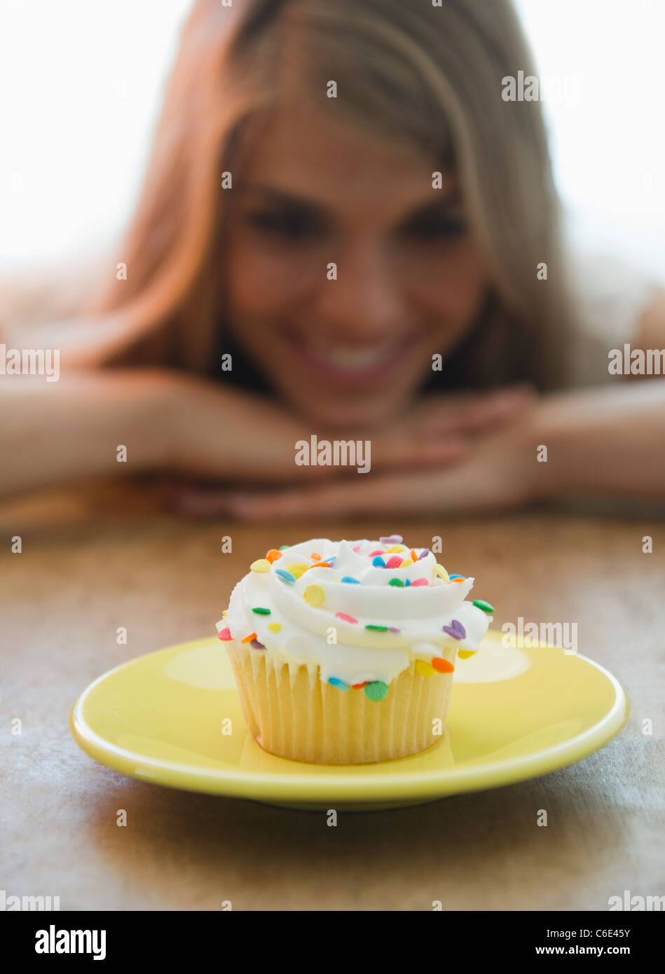 USA, New Jersey, Jersey City, Close up of women looking at cupcake Stock Photo