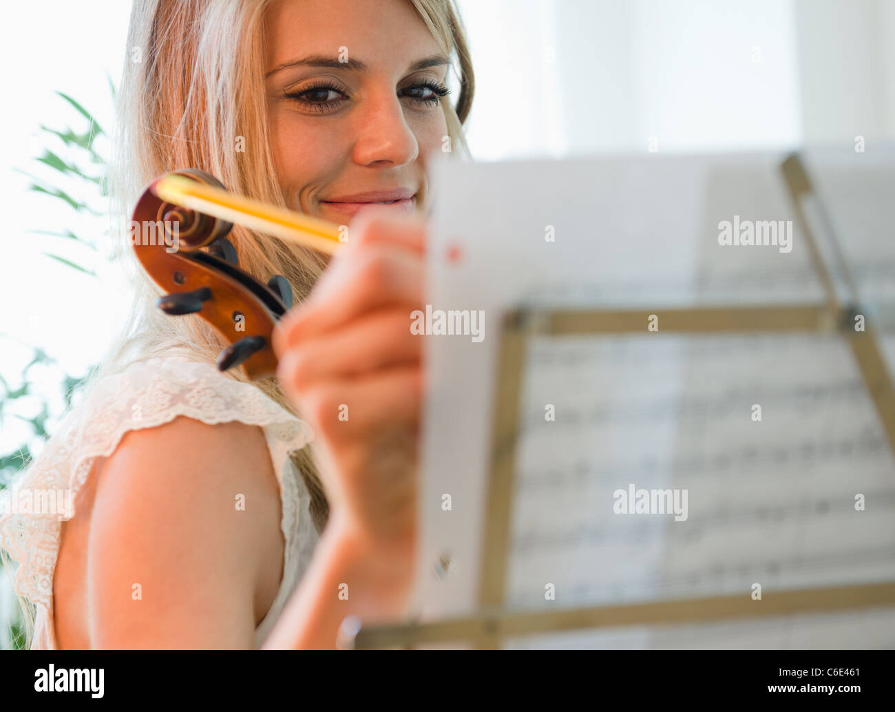 USA, New Jersey, Jersey City, Woman composing music Stock Photo