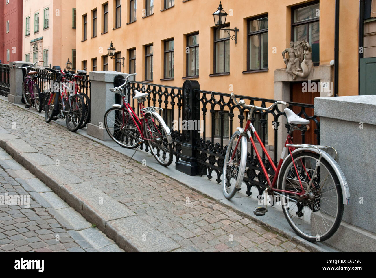 Red bicycles in Gamla Stan (Old Town) in Stockholm, Sweden Stock Photo