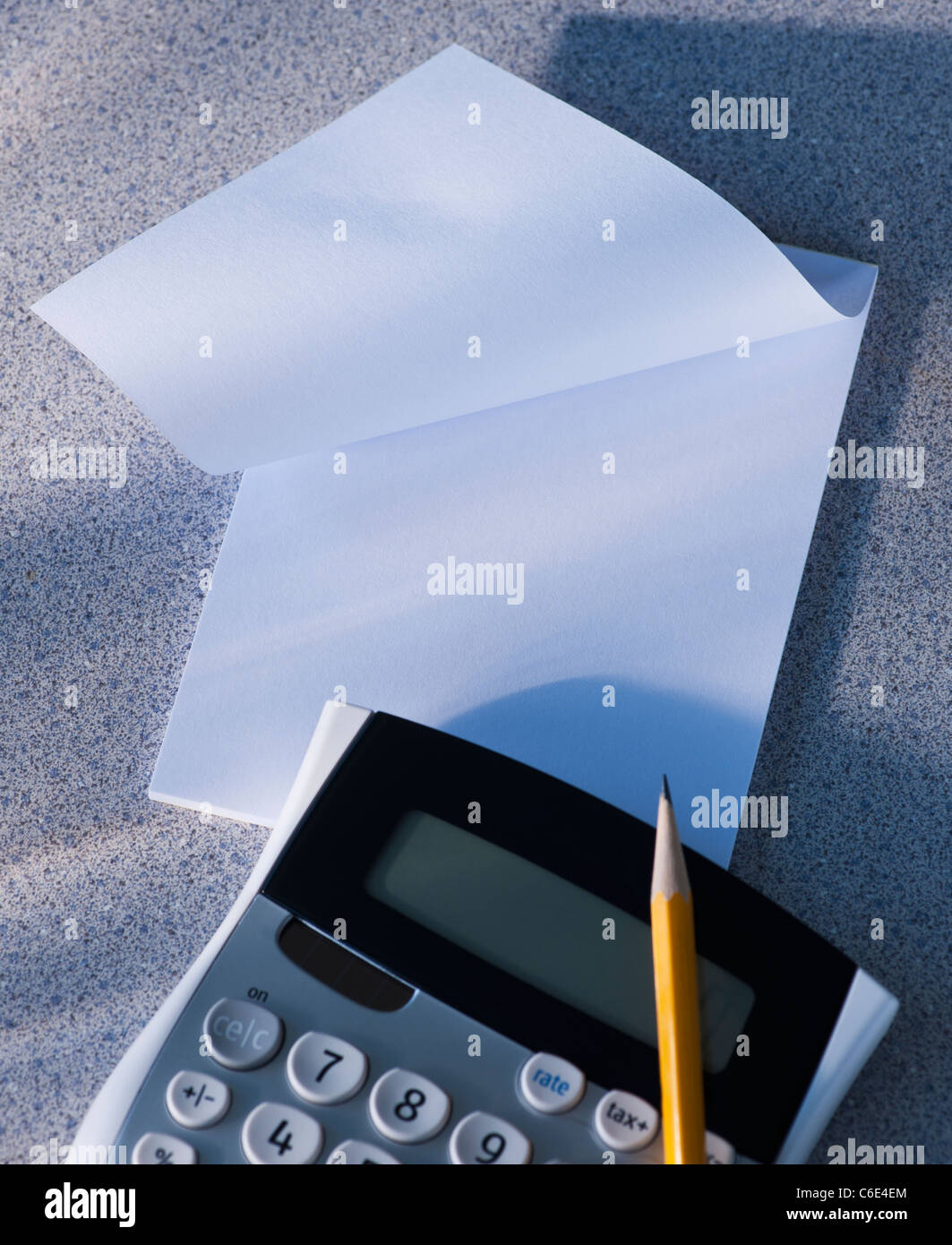 Calculator and blank paper Stock Photo - Alamy