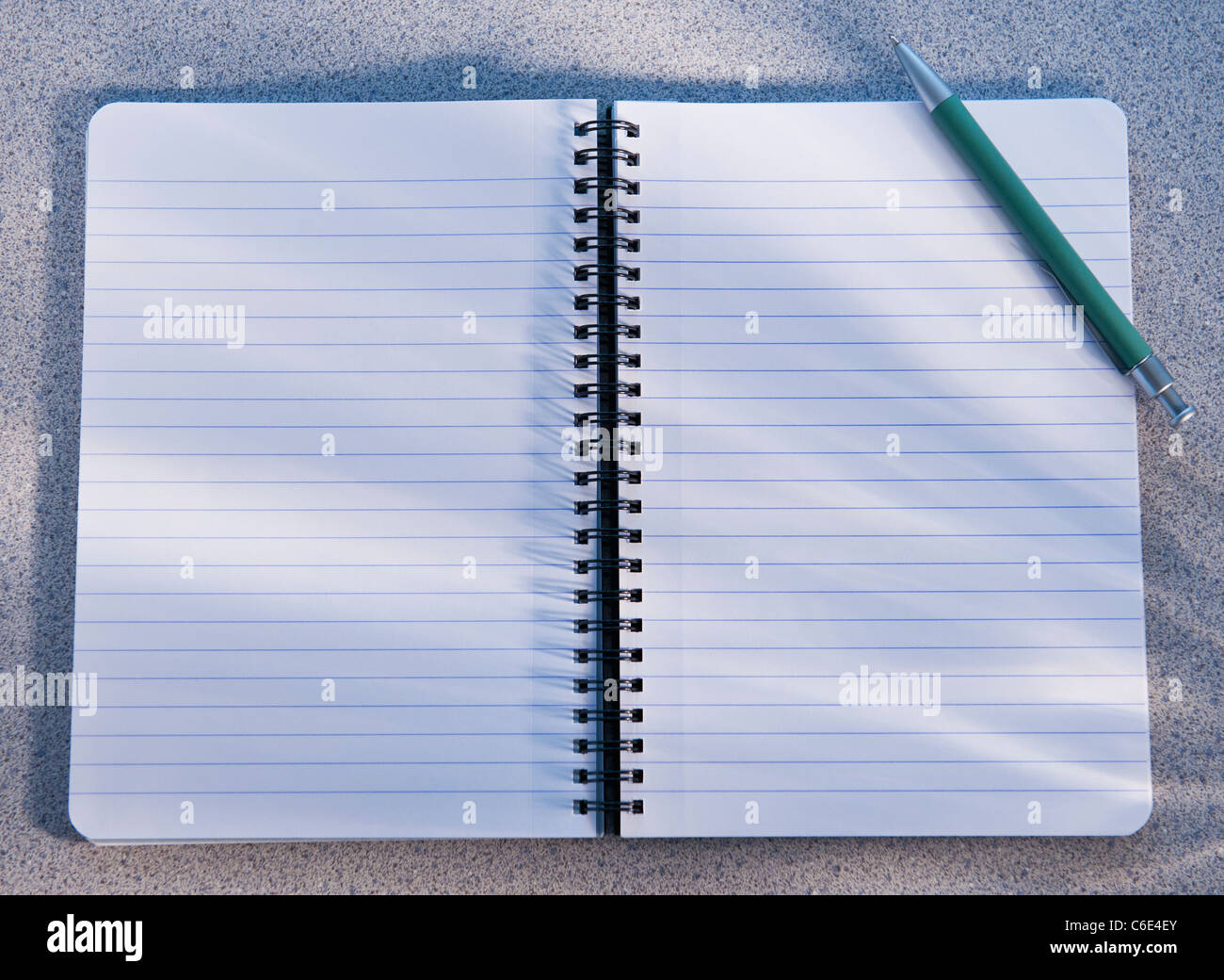 Blank open notebook and pencil Stock Photo