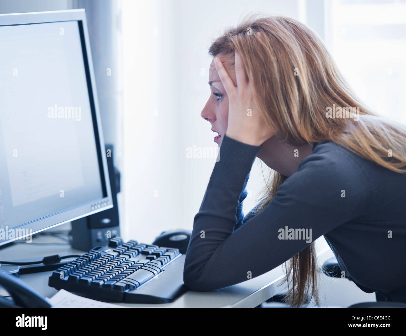 Woman leaning on elbows desk hi-res stock photography and images - Alamy