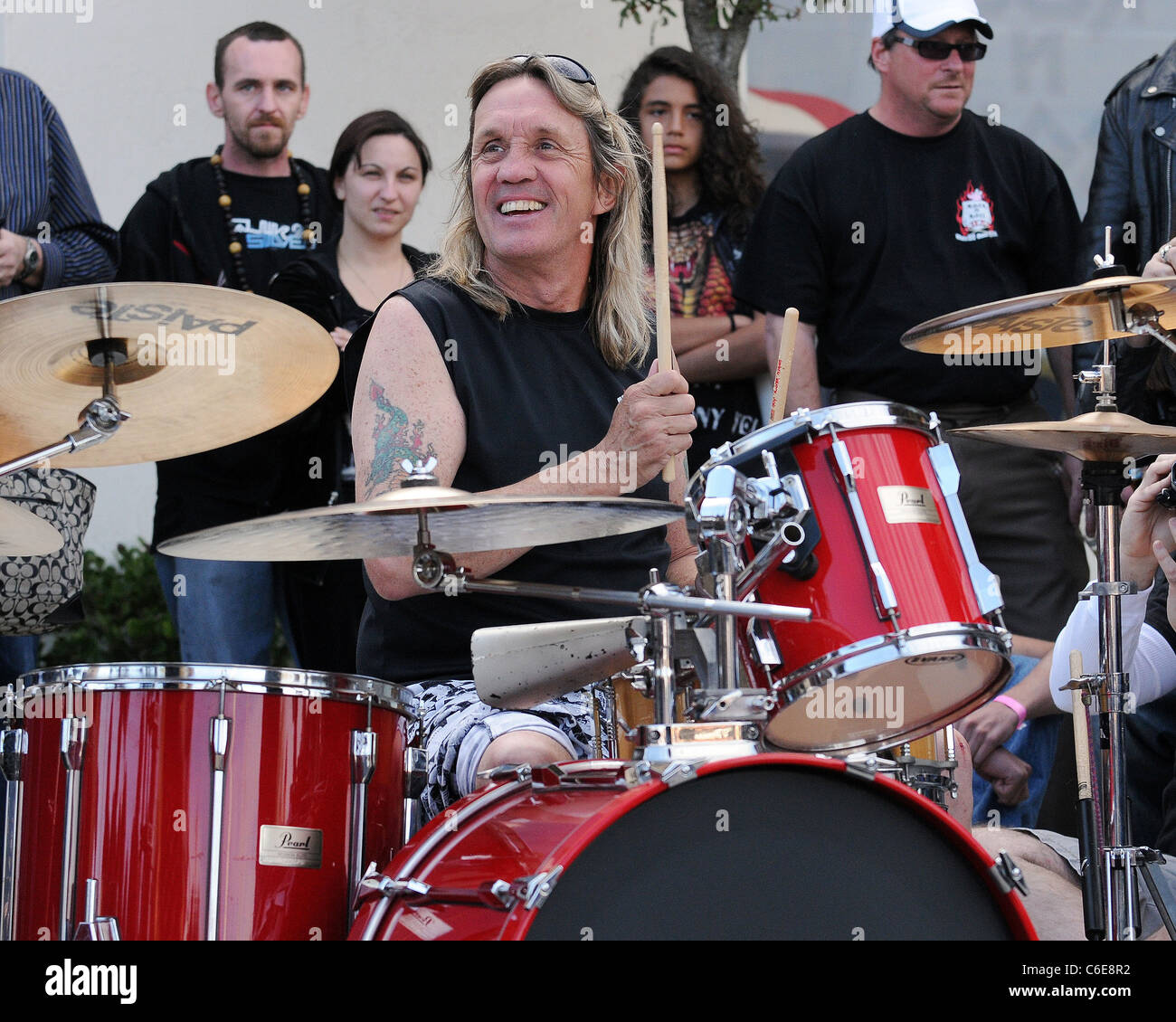 Iron Maiden drummer Nicko McBrain celebrates the grand opening of his 