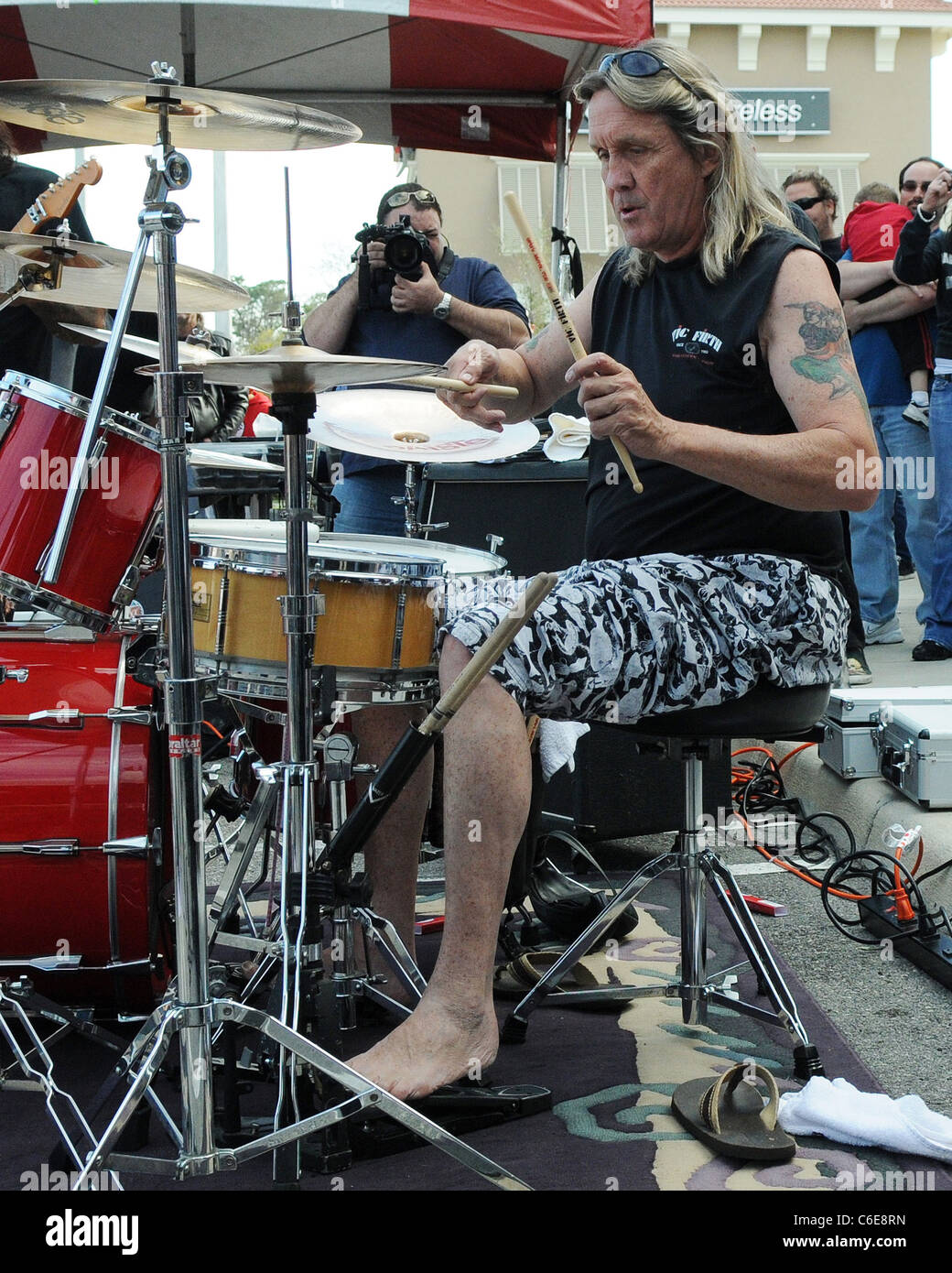 Iron Maiden drummer Nicko McBrain celebrates the grand opening of his 
