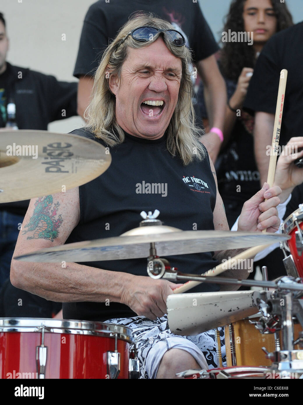 Iron Maiden drummer Nicko McBrain celebrates the grand opening of his