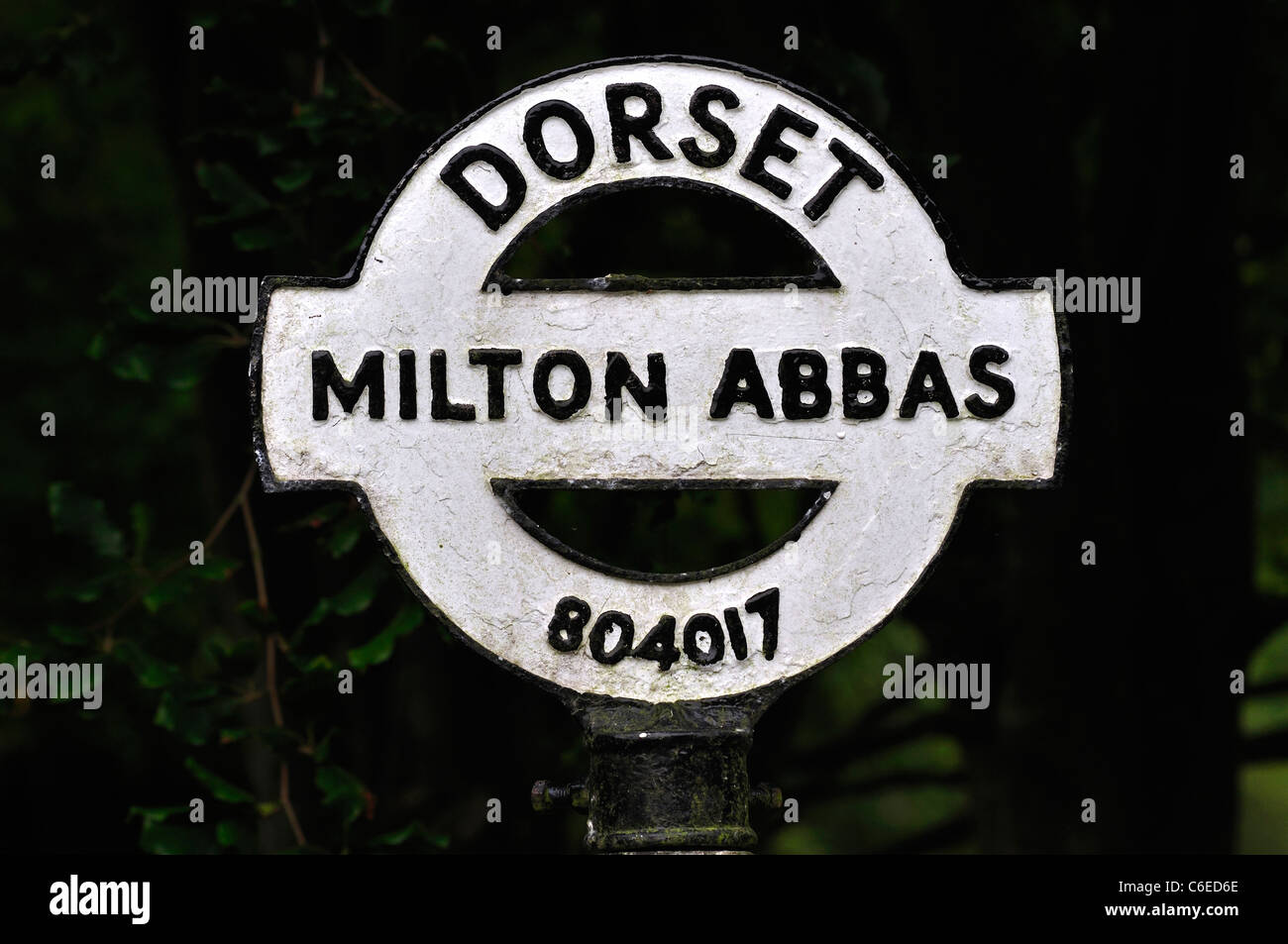 The white round top of a traditional Dorset finger post at Milton Abbas UK Stock Photo