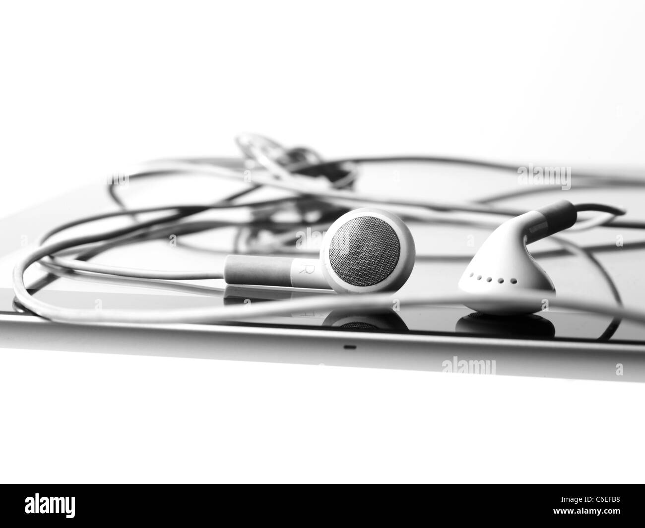 Studio shot of digital tablet and earphones Stock Photo
