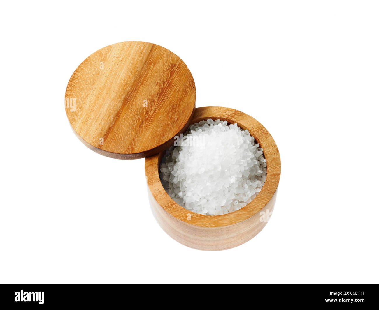 Studio shot of salt in wooden grinder Stock Photo