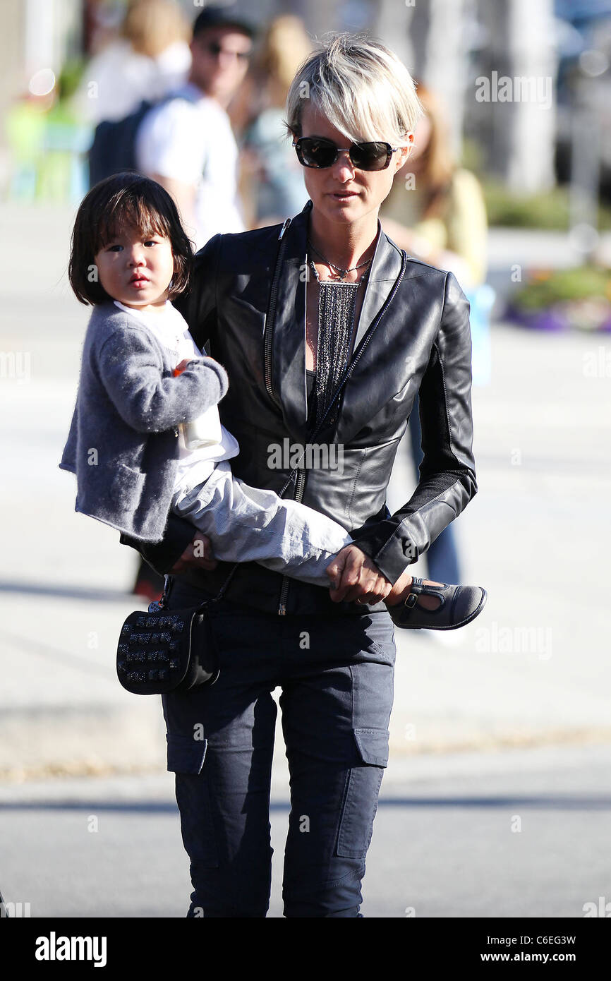 Johnny Hallyday's wife, Laeticia Boudou, and their adopted daughter, Jade  Odette Desiree, out and about on Robertson Boulevard Stock Photo - Alamy