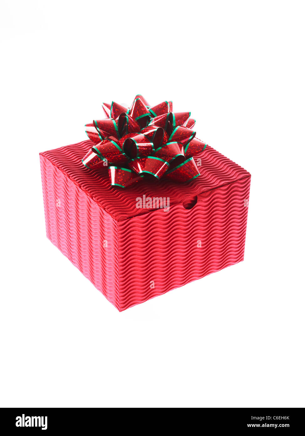 Studio shot of Red Box and Red and Green Ribbon on white background Stock Photo
