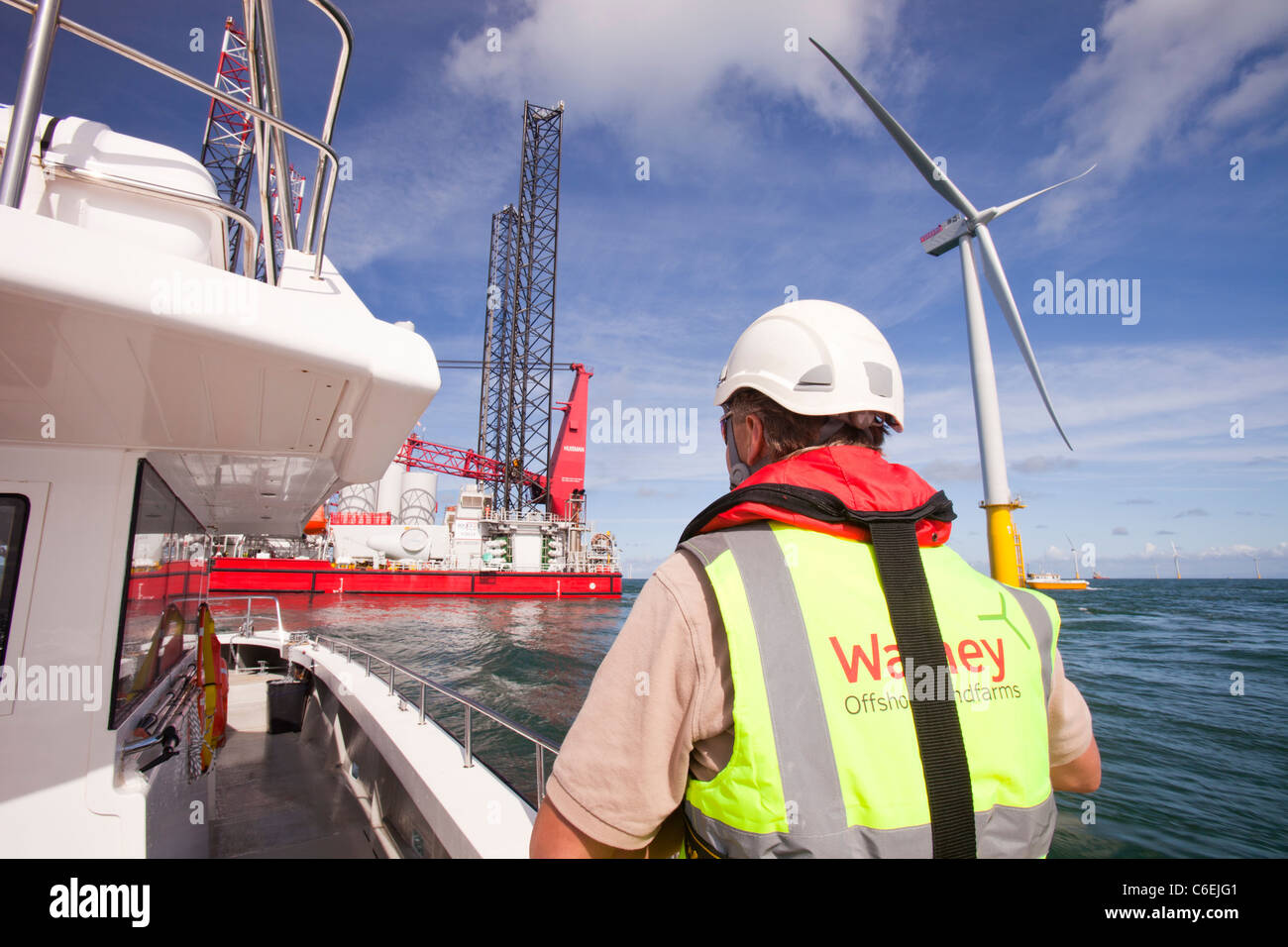 A health and safety inspector on a crew transfer vessel at the Walney offshore wind farm, Stock Photo