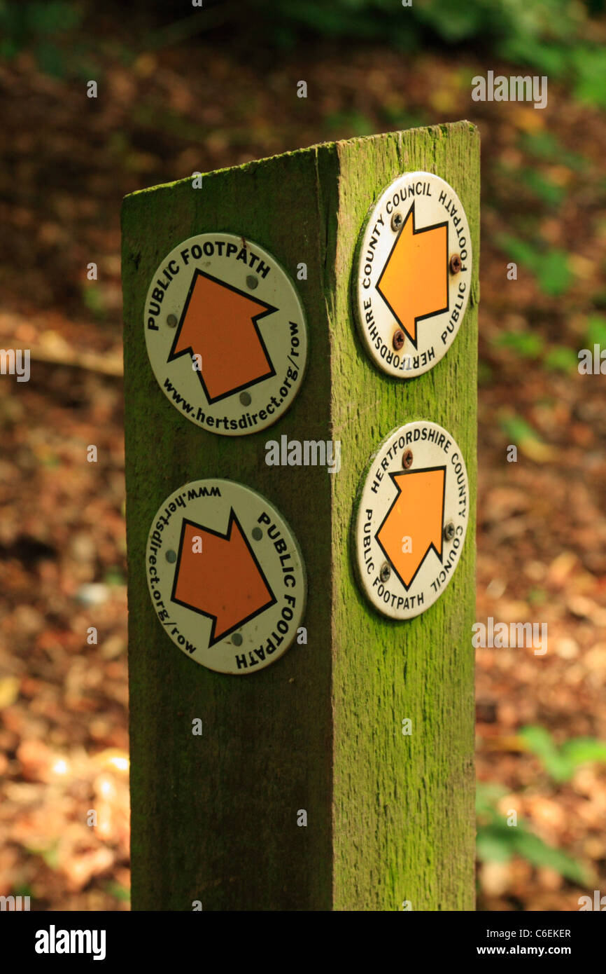 Footpath signs attached to a wooden post in Hertfordshire, United Kingdom Stock Photo