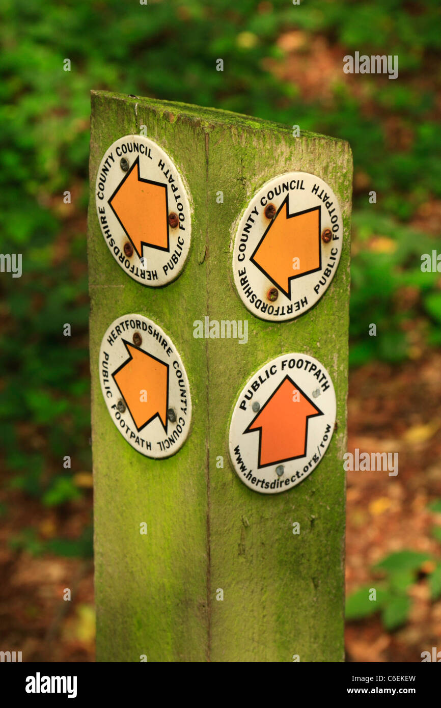 Footpath signs attached to a wooden post in Hertfordshire, United Kingdom Stock Photo