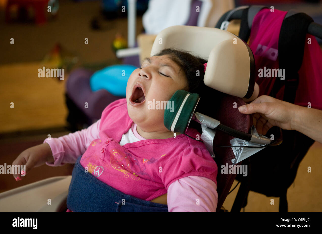 Seven year old deaf blind child vocalizing during a speech therapy