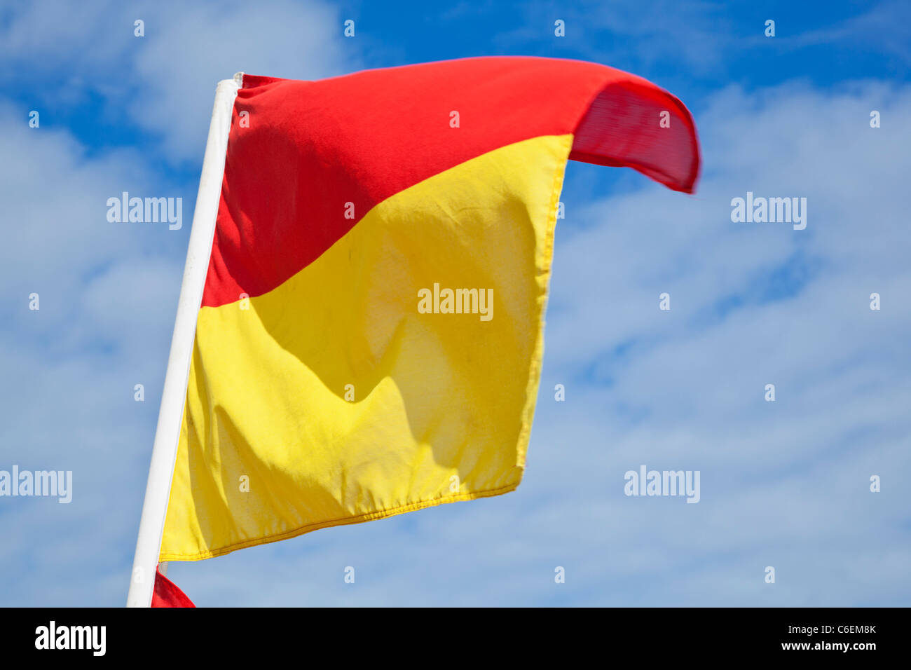 Lifeguard on duty warning flags yellow and red on newquay beaches