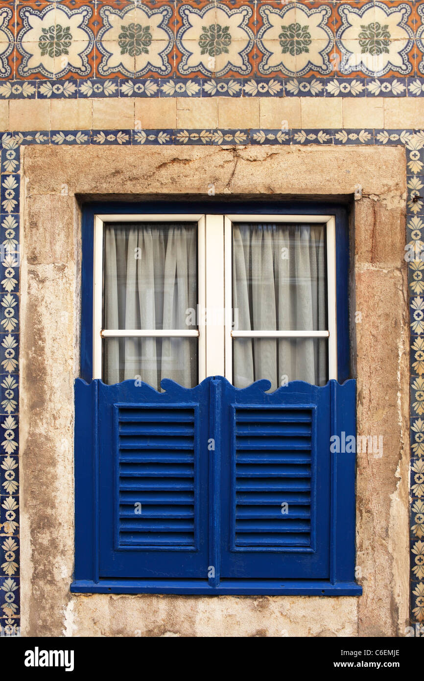 A window with blue wooden shutters in Lisbon, Portugal Stock Photo Alamy