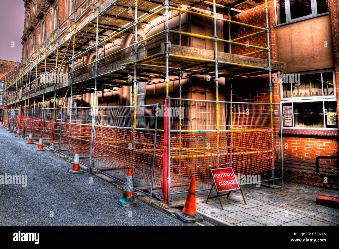 Scaffolding taking up path to cover Louth Town Hall  hdr tonemapped. Footpath closed Stock Photo