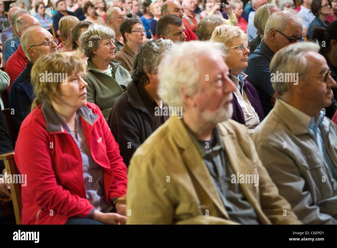 Audience listening to jazz concert in Brecon Cathedral during Brecon Jazz Festival 2011 Stock Photo