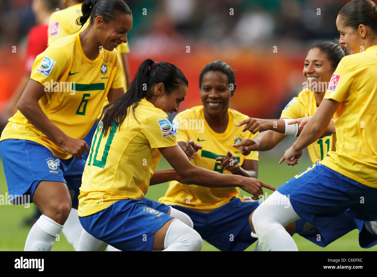 Marta of Brazil (10) celebrates with teammates after scoring a goal in a 2011 Women's World Cup Group D match against Norway. Stock Photo