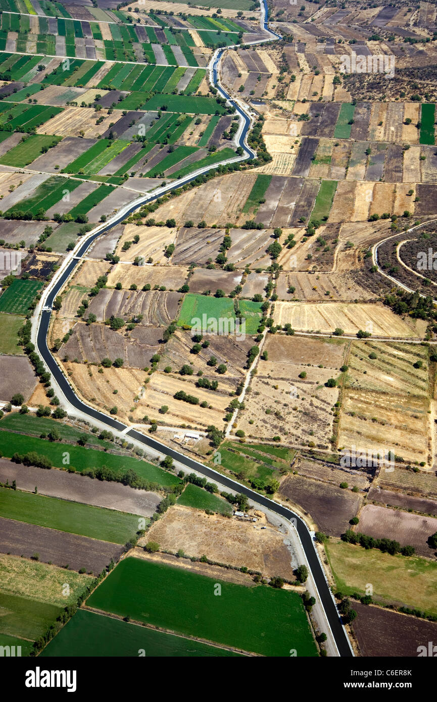 Aerial view of irrigation canal through agricultural landscape in