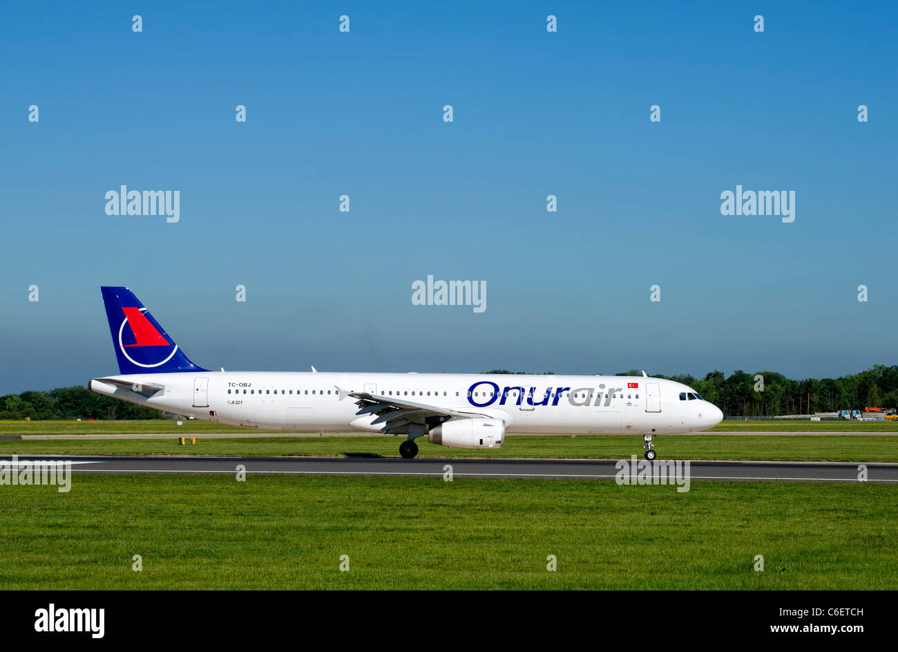 OnurAir aircraft on the runway at Manchester Airport Stock Photo