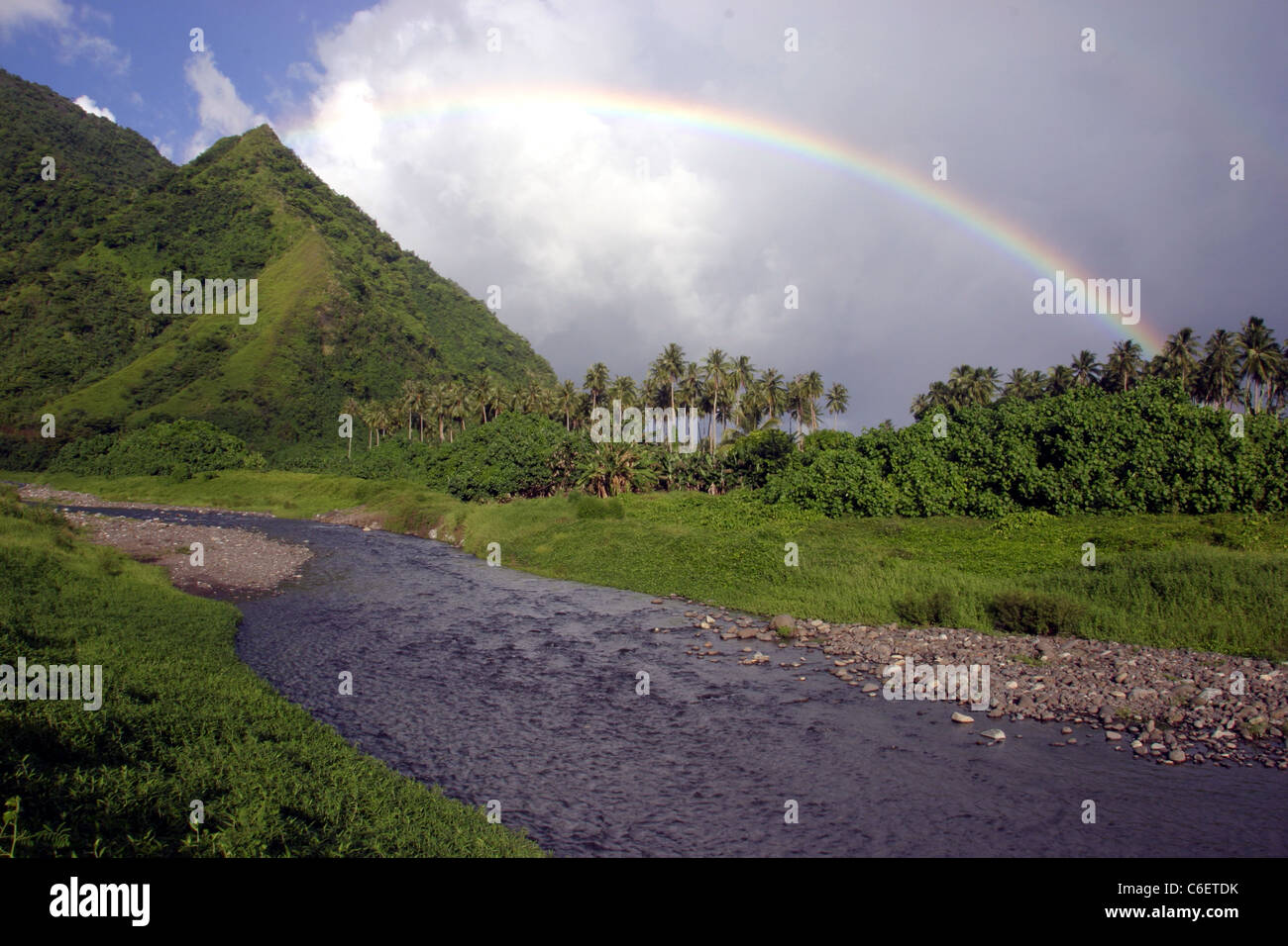 Rainbow over stream. Teahupoo, Tahiti, French Polynesia, South Pacific