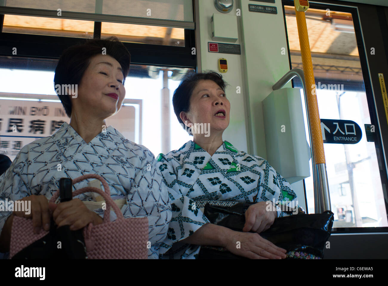 Two Japanese Women in Kimono on a Tramway, Nagasaki, Japan Stock Photo