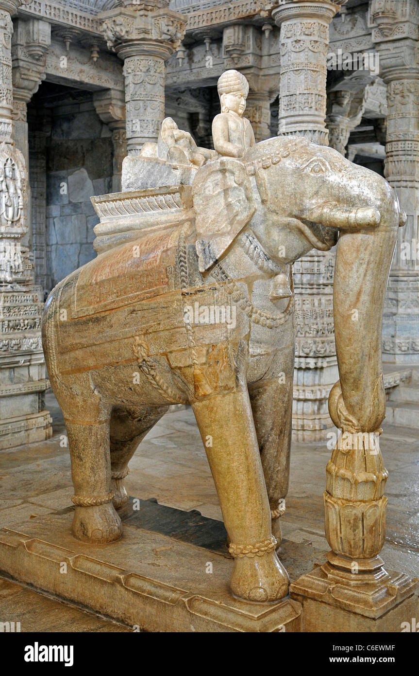 Stone carving of elephant and mahout Chaumukha Mandir Jain Temple Ranakpur Rajasthan India Stock Photo