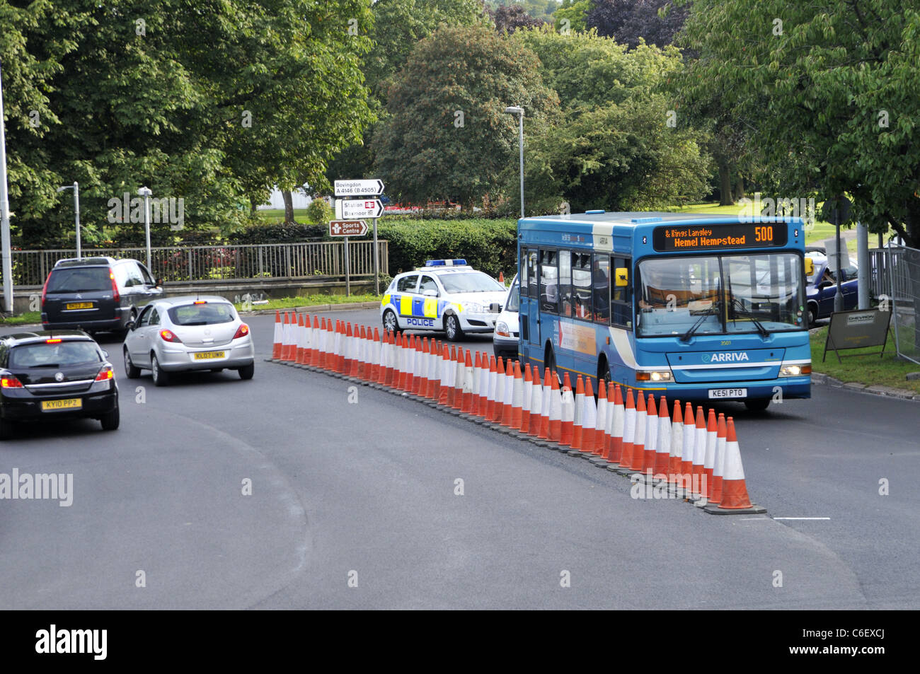 Bus and police car using the Hemel Hempstead magic roundabout, UK. Stock Photo