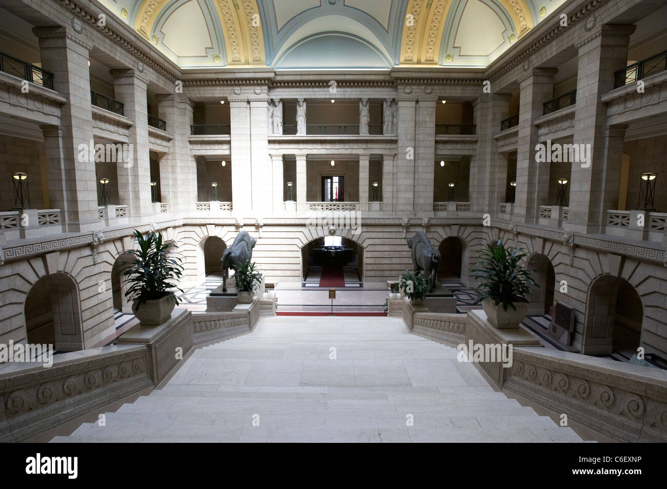looking down interior of manitoba legislative building with grand staircase and huge bronze bison winnipeg manitoba canada Stock Photo