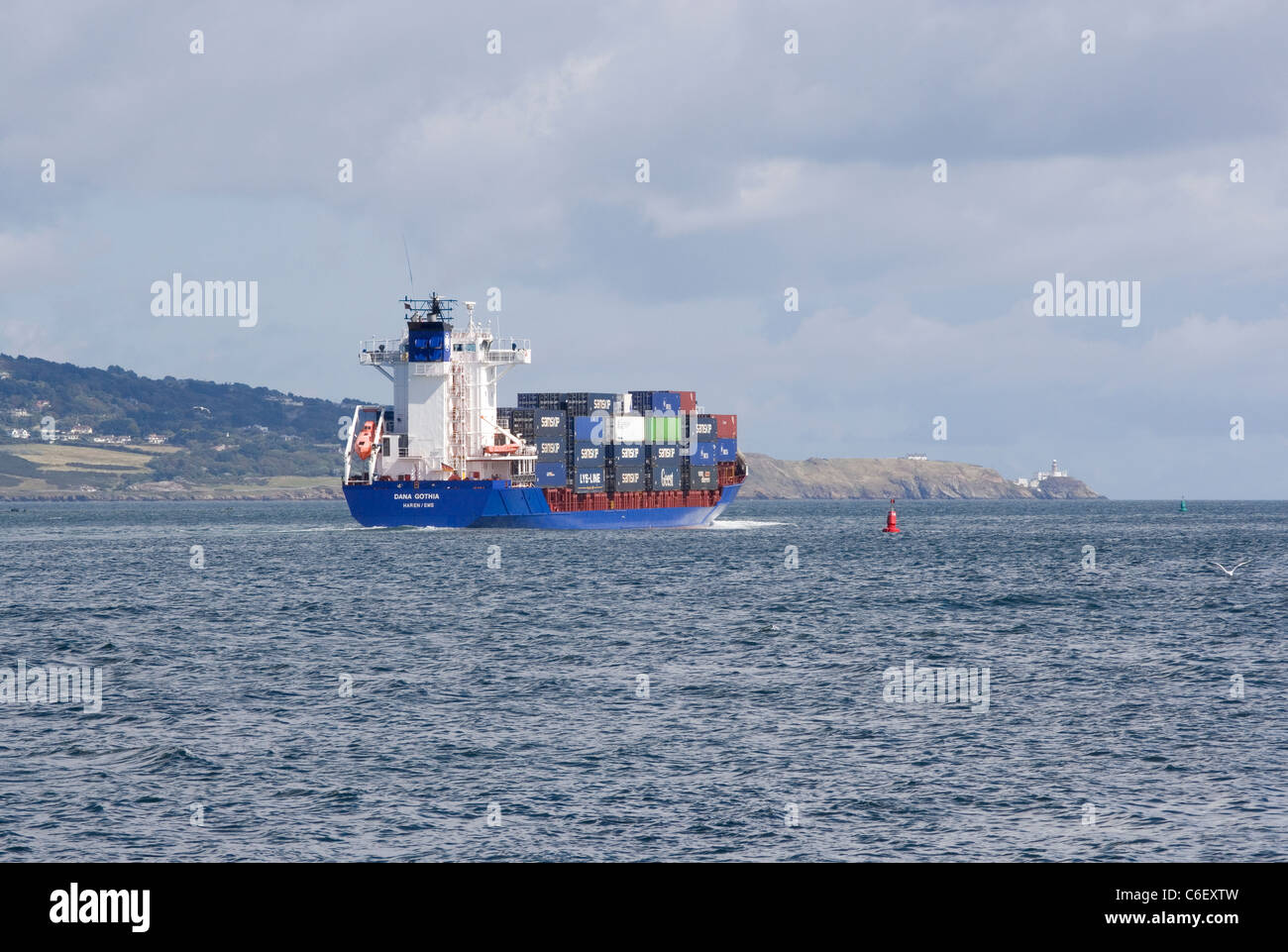 container,ship.cargo.sea.ocean,Dublin Bay,open sea,boat,package,roll on, roll off,shipping,commerce,container ship Stock Photo