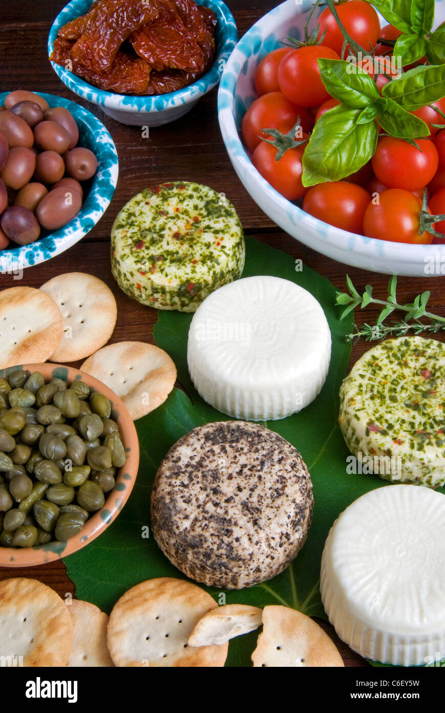 Maltese appetizer goat cheeses (Gbejnjet), capers, tomatoes, olives