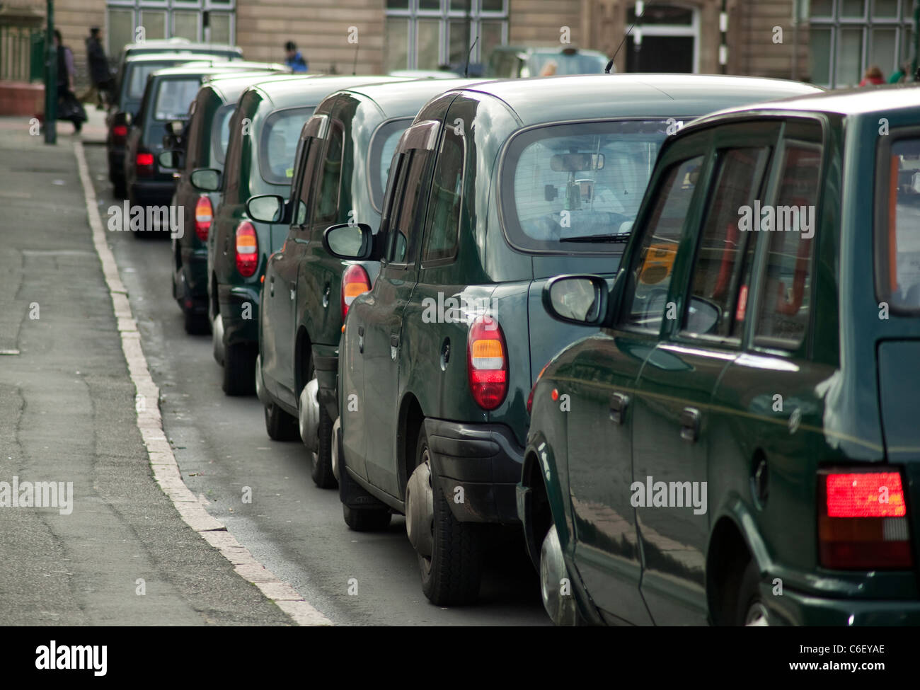 Line up of taxis in a rank Stock Photo