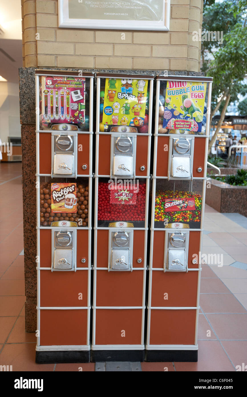 candy sweets coin operated dispensers in a shopping centre mall winnipeg manitoba canada Stock Photo
