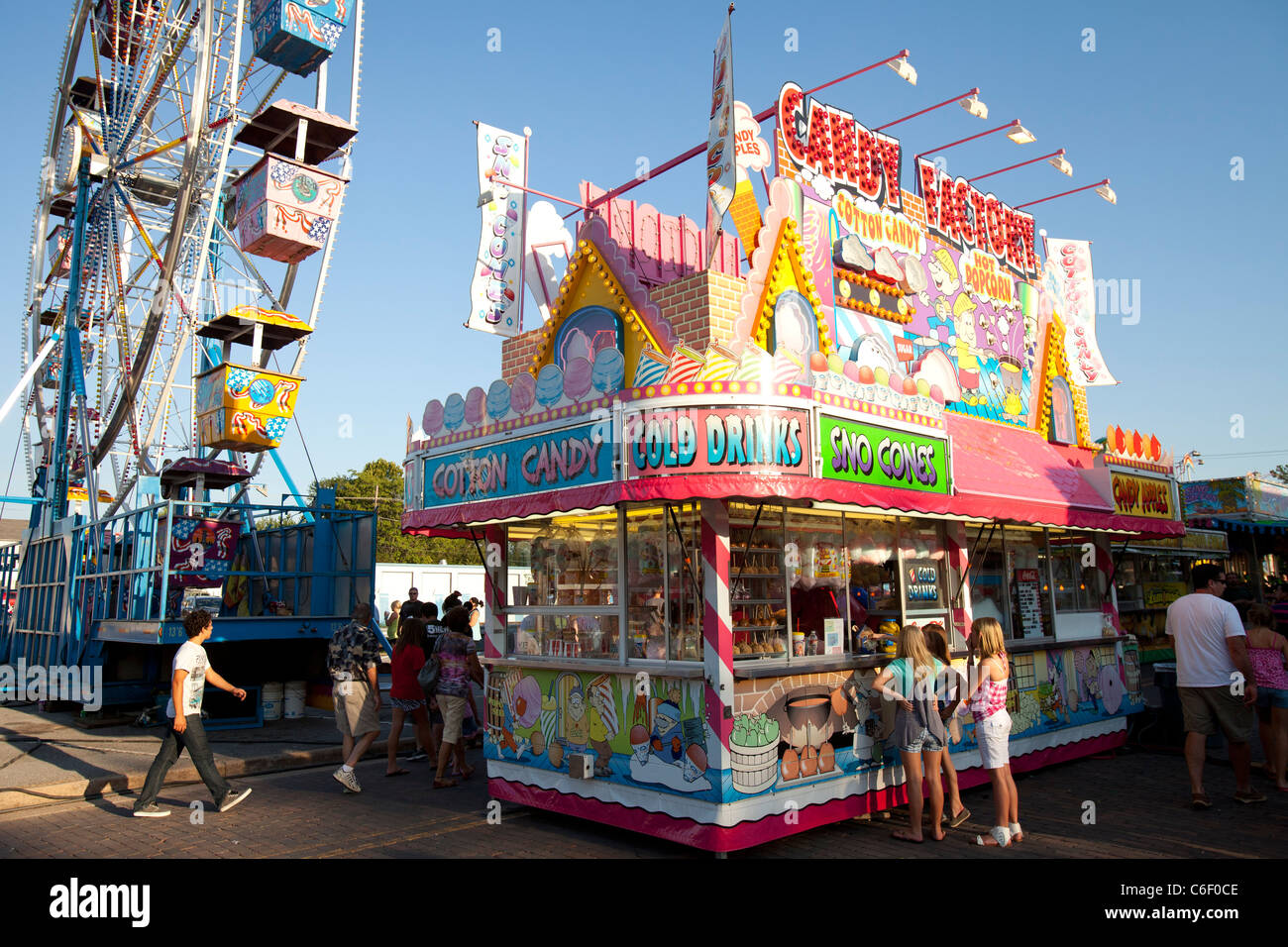 Children place their order at a food vendor stand during a carnival in Rogers, Arkansas. Stock Photo