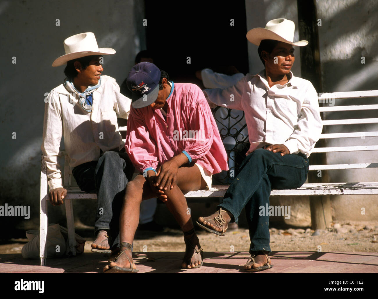 Indigenous Tarahumara men in the Copper Canyon township of Batopilas await the outcome of a political protest. Stock Photo