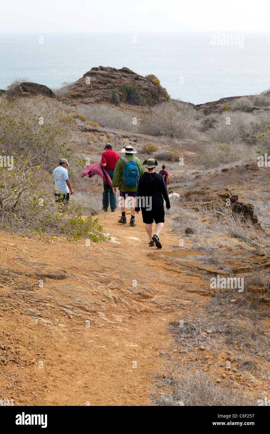 Hikers on the trail at Punta Pitt, San Christobel, Galapagos Stock Photo