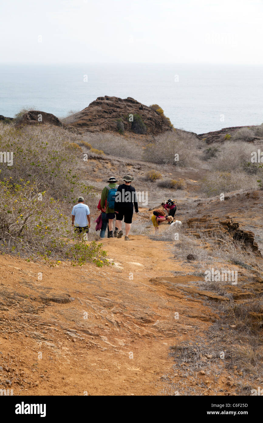 Hikers on the path at Punta Pitt, San Christobel, Galapagos Stock Photo