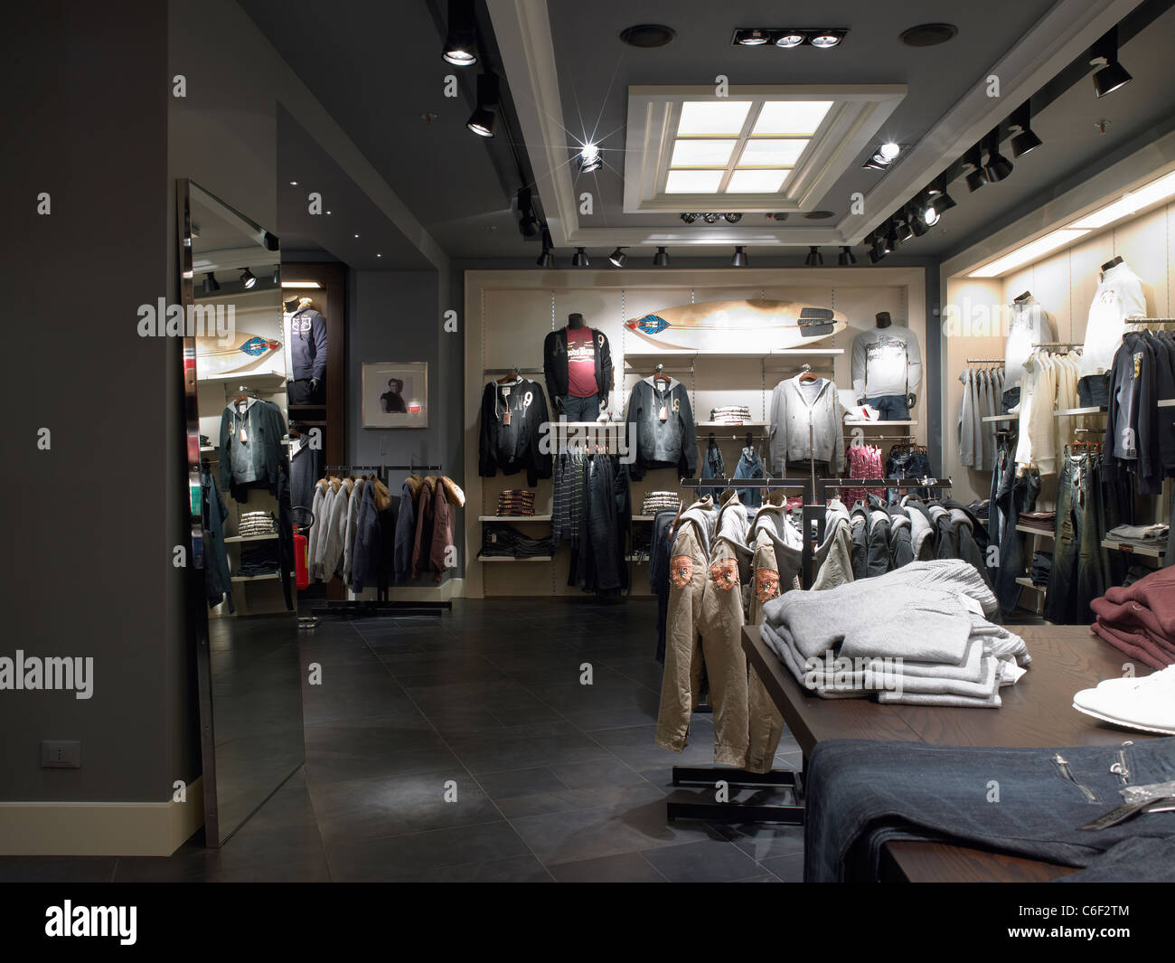 interior of a contemporary store in Italy selling clothing clothes ...