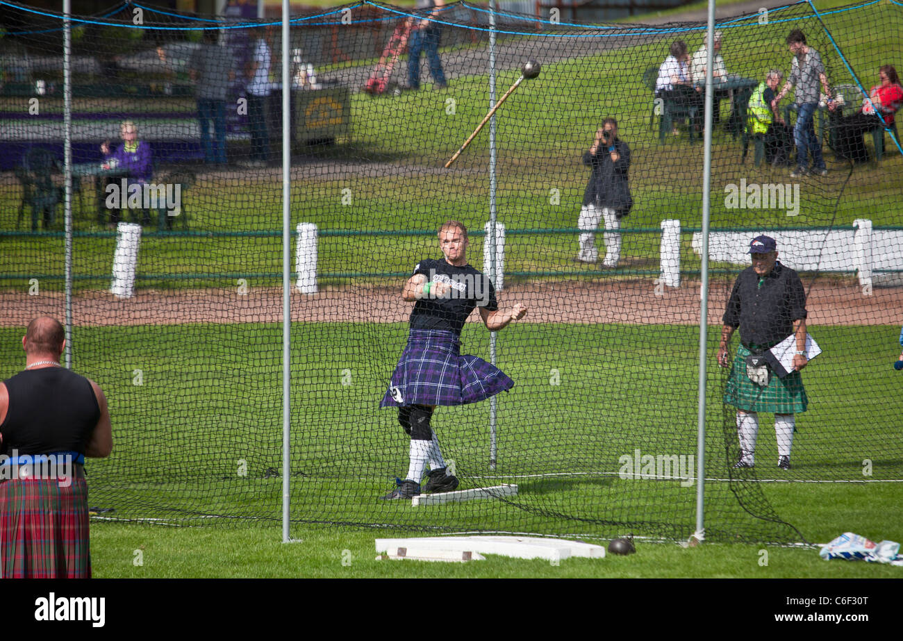 Competitor throwing the hammer, Scottish standing style, in the Heavy