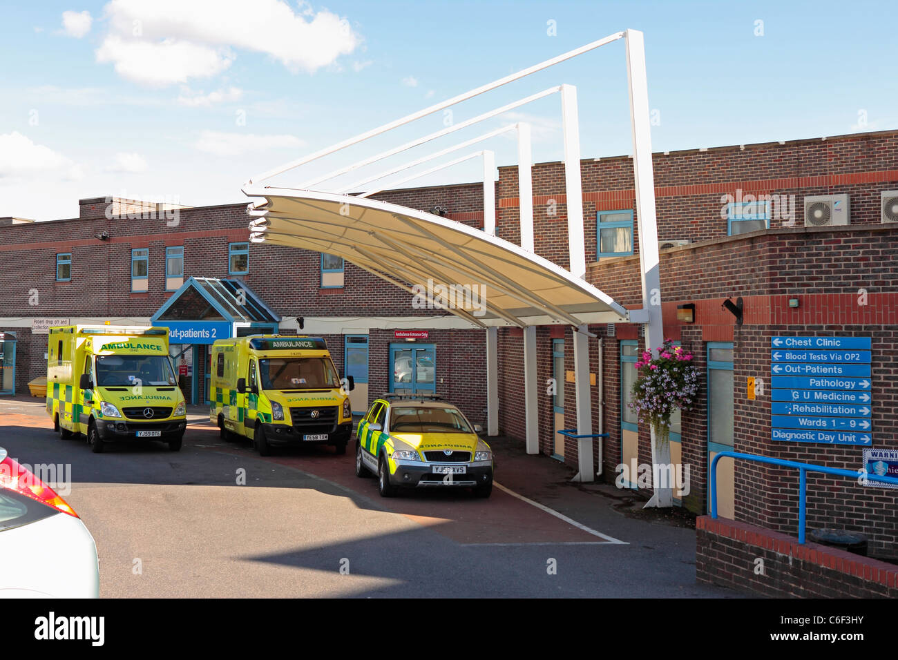 Doncaster Royal Infirmary A&E Accident and Emergency Department and Outpatients 2 entrance with ambulances and a fast responder parked outside Stock Photo