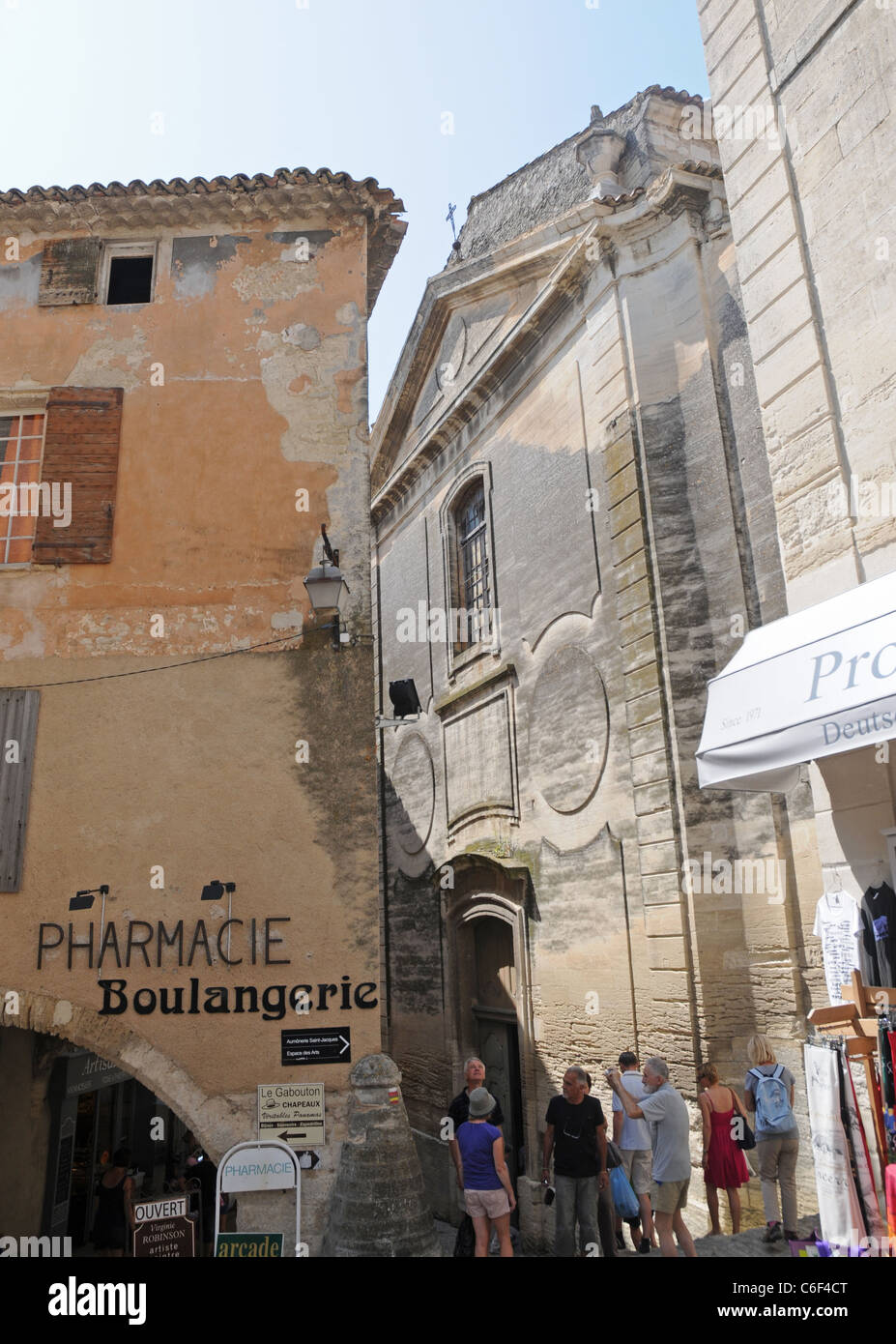 pharmacy and church in Gordes town, Vaucluse department in Provence region, France Stock Photo