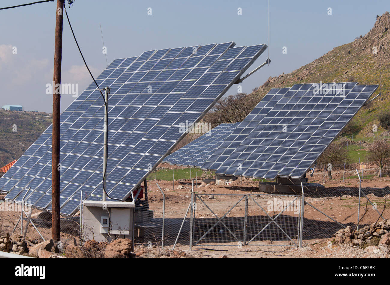 Extensive solar panel arrays in the countryside of west Lesvos (Lesbos), Greece. Stock Photo