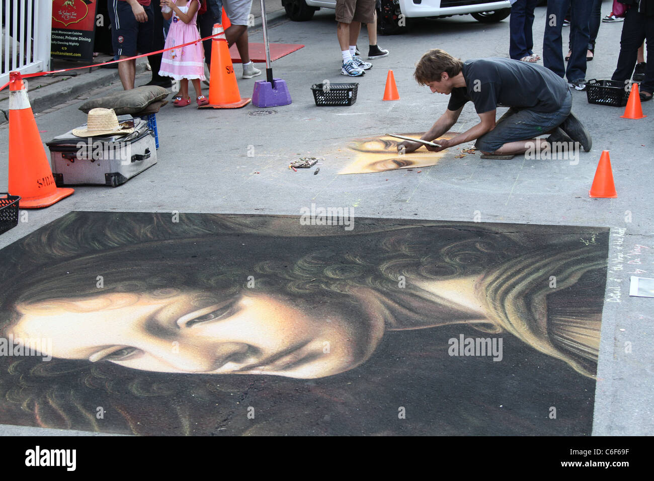 chalk artist drawing sidewalk Stock Photo