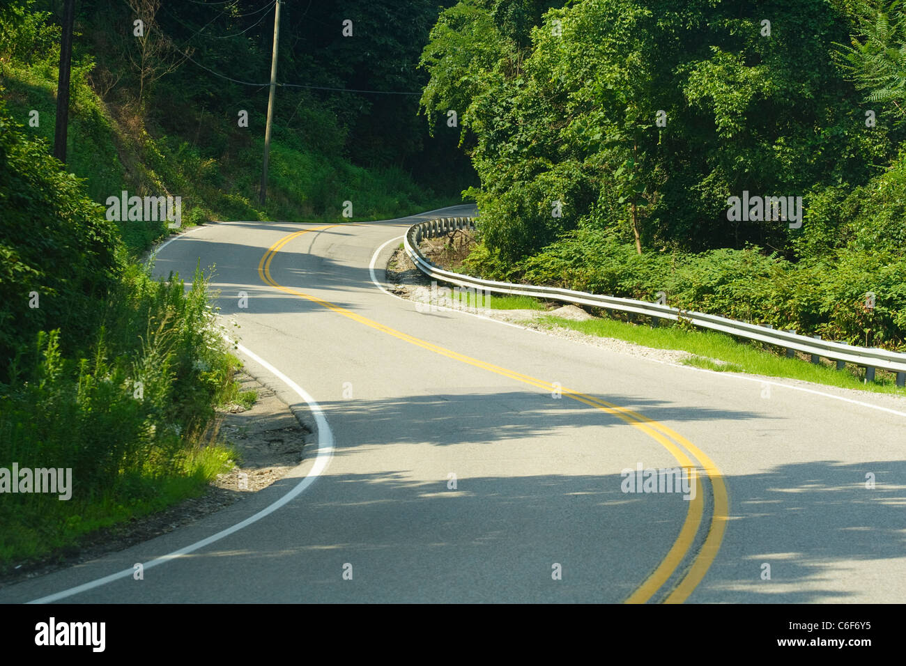 Winding, curvy road in the mountains near Cabin Creek, WV on a sunny