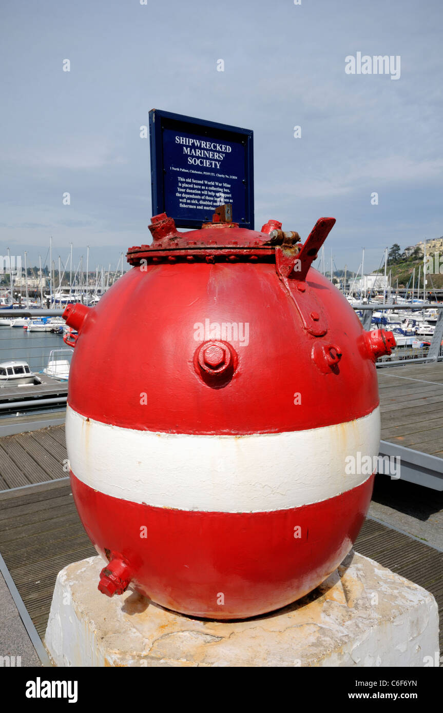 Old Second World War Mine placed in front of Torquay Harbour as a collection box in Devon Stock Photo