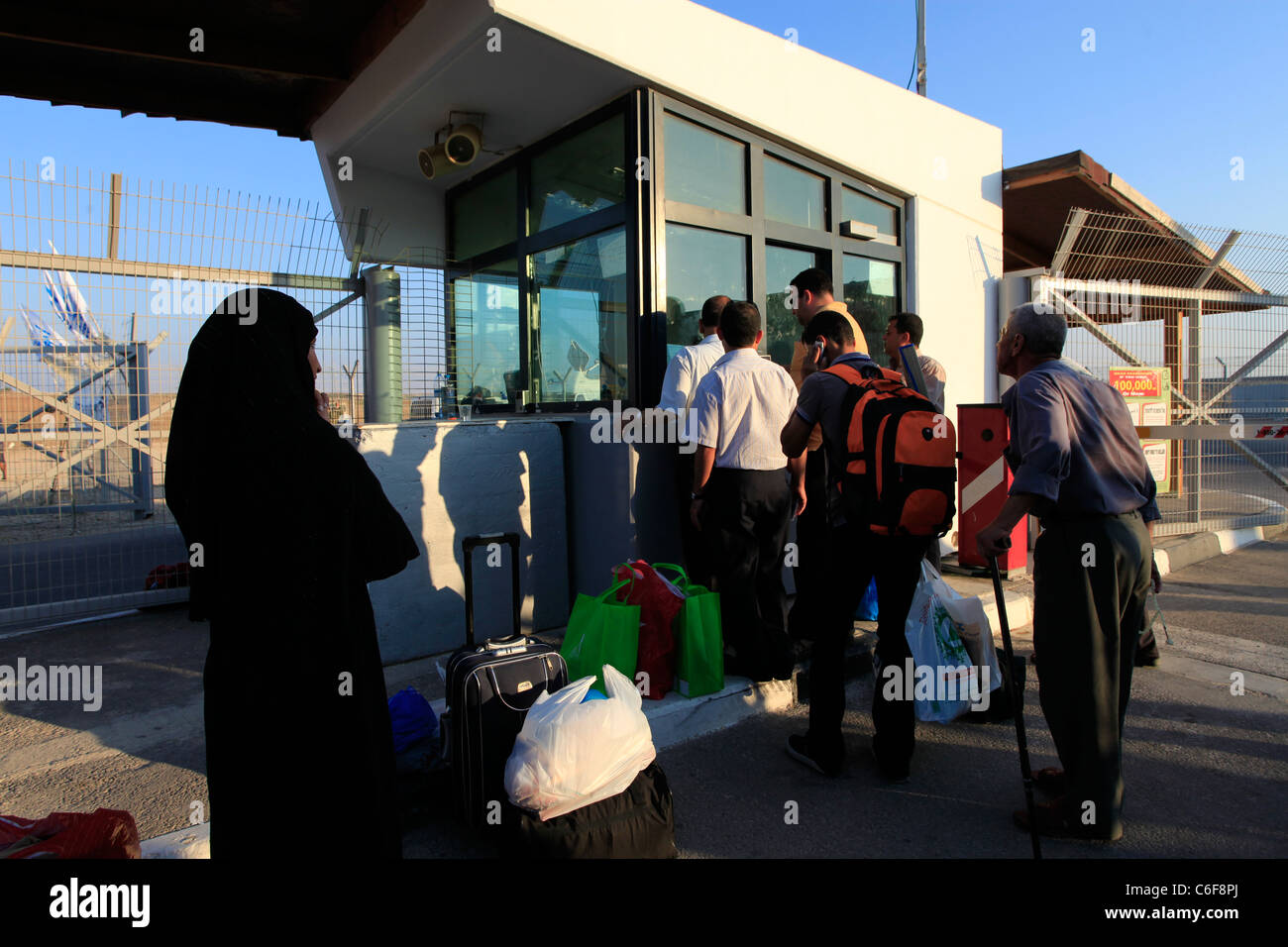 Palestinians on their way to Gaza enter the Erez border crossing also ...