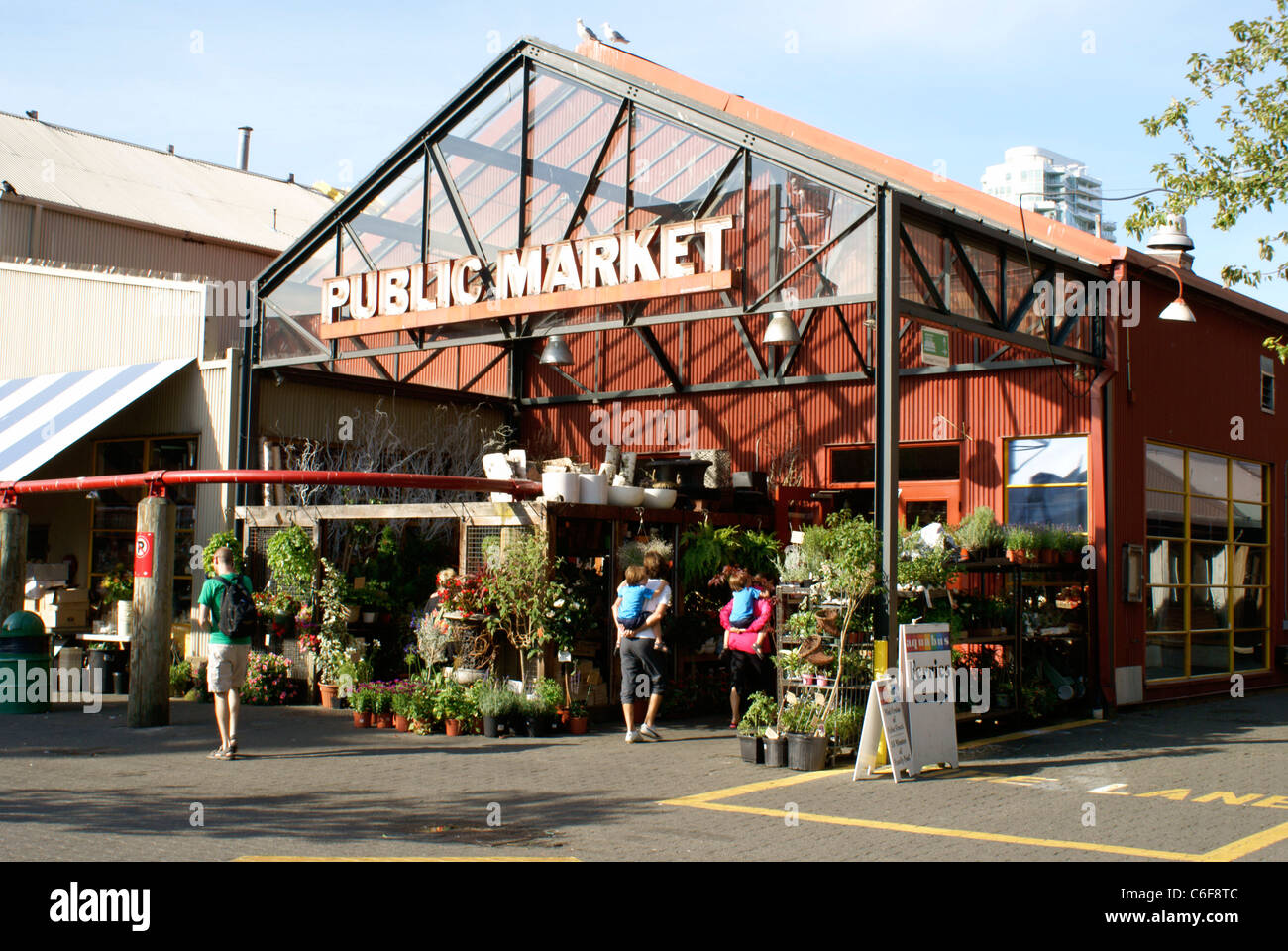 People outside the entrance Granville Island public market, Vancouver, British Columbia, Canada