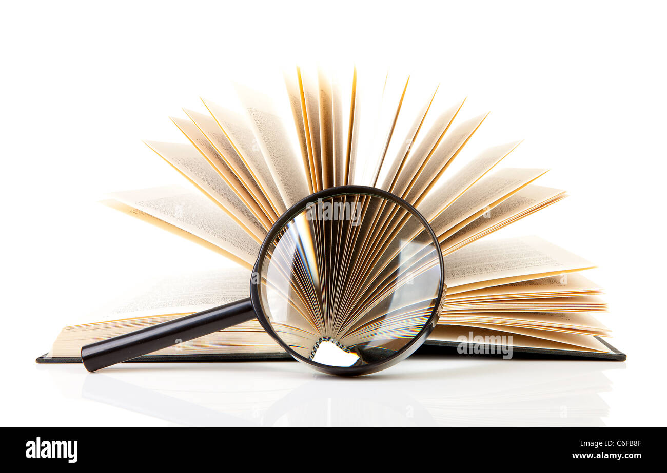 open book with magnifying glass over white background Stock Photo - Alamy